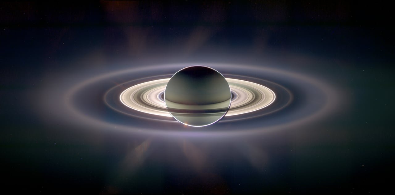 default-338 A planet surrounded by rings in space.